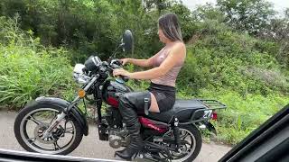 Jarlyn rides her motorcycle on the highway  Kickstarting in boots and silky top [upl. by Mandle]