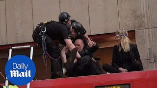 Authorities arrest climate change protesters glued to London train [upl. by Tadeo]