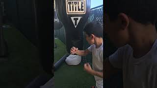 Giovanni quotNyquilquot Nickelz practicing ab checks on the heavy bag with his bareknuckles [upl. by Maisel]