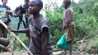 Children in South Kivu province DRC washing soil for rare ore cassiterite [upl. by Alemrac]