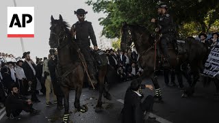 UltraOrthodox Jews block highway to protest Israels new mandatory military service ruling [upl. by Saerdna719]