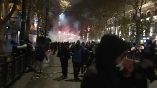 Protesters in Georgia shoot fireworks as riot police create barricade  AFP [upl. by Dur407]