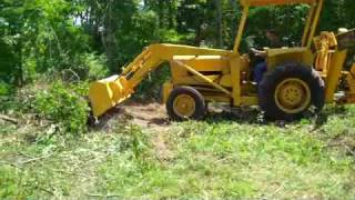 Ford 420 Backhoe Clearing Land [upl. by Olbap]