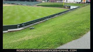 Husqvana 450X Automower Used To Mow A Steep Hill  A Baseball Stadium [upl. by Adli]