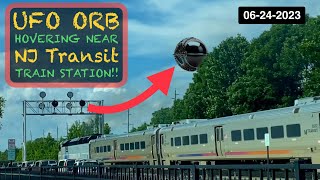 WATCH OMINOUS DARK UFO DRONE ORB HOVERS near NJ TRANSIT Train Station Rutherford 062423 [upl. by Anawait49]