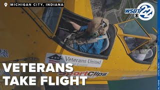 Local senior veterans take flight in an open cockpit biplane [upl. by Raji490]