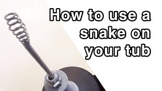 How to Unplug a Bathtub Drain Using a Snake or Drum Auger [upl. by Lesde]