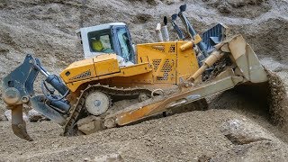 Prototype Liebherr PR776 dozer pushing boulders and gravel [upl. by Aciraj]