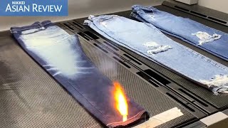 Uniqlo uses lasers to make distressed denim jeans to cut water consumption [upl. by Nwahsd]