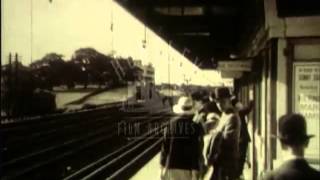 1930s London railways Commuters and steam trains Film 34031 [upl. by Ahsenac]