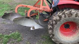 Compact tractor plowing with a 2 bottom plow [upl. by Devonne]