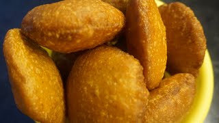 Kobbari Burelu Recipe  Jaggery Sweet Recipe  నోరూరించే కొబ్బరి బూరెలు [upl. by Etnoed]