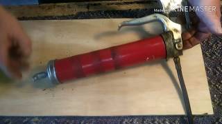 Change a grease gun cartridge  easy [upl. by Einiar382]