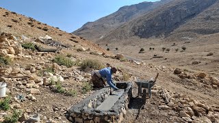 Irans nomadic life making a water trough for sheep with natural stone in the mountains [upl. by Yllek]