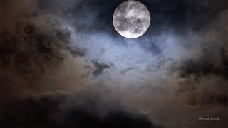 Full Moon at Perigee in a dramatic cloudy sky  4k Ultra HD [upl. by Dorweiler701]