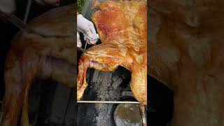 Roasted whole lamb is golden in color carne asado comida delicioso [upl. by Elisabet617]