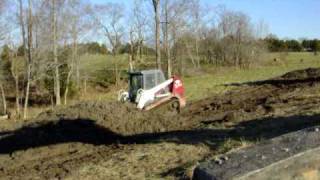 TakeuchiTL150 Skid Steer Moving mud [upl. by Aserret]