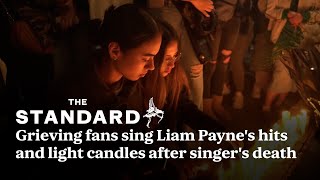 Liam Payne grieving fans sing hits and light candles after singers death in Argentina [upl. by Anirpas]