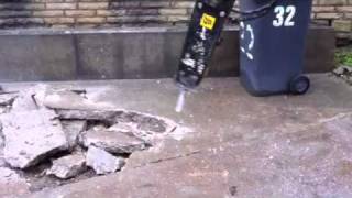 Mini digger breaking concrete [upl. by Oswal]