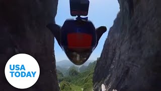 Wingsuit flyer conquers worlds highest natural cave in China  USA TODAY [upl. by Hedvige]