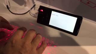 Coque iPhone clavier Laser  iPhonfr  CES 2015 [upl. by Fretwell]