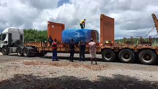 Loading flat hack container with giant otr tires in Brazil by otrSupply [upl. by Enrev]