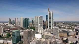 Scanclimber SC8000 mast climber cladding the 148 m Eurotower skyscraper in Frankfurt Germany [upl. by Icnan]