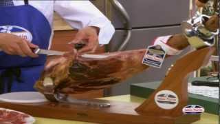 How to Carve Iberico Ham from wwwfoodsofspaincouk  Spanish Food Online [upl. by Aylsworth]