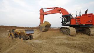 Hitachi Zaxis 670LCH5 loads Komatsu HM4003 [upl. by Oahc]