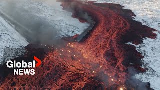 Iceland volcano Mesmerizing drone video shows bubbling lava swallow road near Blue Lagoon [upl. by Chloras]