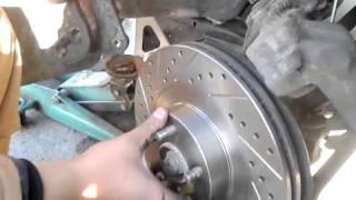 How to replaceinstall drilled and slotted rotors on a 2002 Subaru WRX [upl. by Yklam]