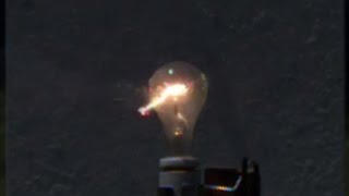 Shooting the filament out of a light bulb with an MampP 22 compact pistol in SUPER slow mo [upl. by Enilesor880]