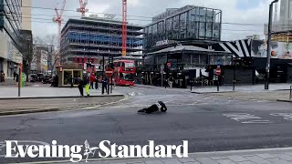 Pedestrians fall over in strong winds as Storm Eunice hits the UK [upl. by Enayr]