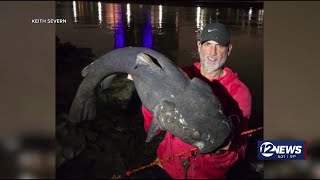 Fisherman reels in hefty catch near downtown Wichita [upl. by Aivatnwahs454]