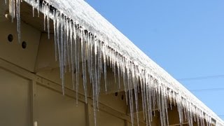 How to Safely Remove Icicles From Gutters [upl. by Nythsa796]