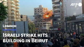 Moment Israeli strike hits building in Beiruts southern suburbs  AFP [upl. by Tigram]