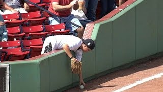 Young fan avoids interfering with fair ball [upl. by Macmillan]