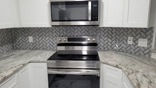 Herringbone Glass Tile Backsplash Installation [upl. by Costello899]