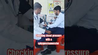 Checking the patients blood pressure with a sphygmomanometer 🩺💉🌡️⚕️⚕️ mbbs bams mbbsanatomy [upl. by Esiuole]