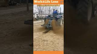 A worker operates a trenching machine that digs a trench for cables [upl. by Sprague]