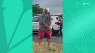 Video shows John Daly hitting golf ball across highway and onto Akron high school football field [upl. by Barby967]