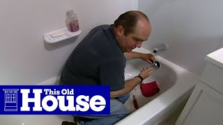 How to Clear a Clogged Bathtub Drain  This Old House [upl. by Manheim501]