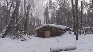 hiding in a huge dugout during a snow storm spending the night in bushcraft shelter [upl. by Amalle]