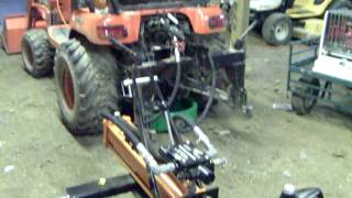 Harbor Freight 3point log splitter attached to a Kubota BX24 [upl. by Otrepur]