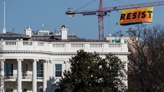 Activists scale crane to protest Trump [upl. by Nyvar958]