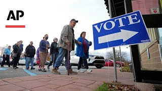 Americans head to the polls to choose between Harris or Trump [upl. by Dettmer]