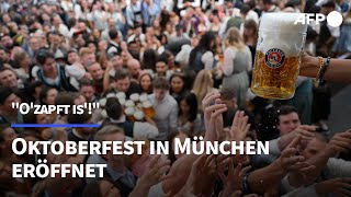 quotOzapft isquot Oktoberfest in München eröffnet  AFP [upl. by Anyalram573]