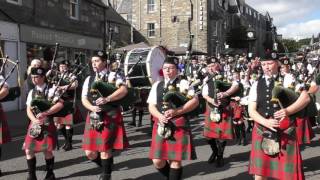 Street Parade of the massed Scottish pipe bands to the 2016 Pitlochry Highland Games in Perthshire [upl. by Bagger]