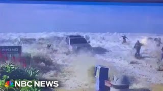 Californians flee from big waves as water breaks over a sea wall [upl. by Dercy146]