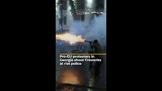 Protesters in Georgia shoot fireworks at riot police  AJ shorts [upl. by Annauj457]